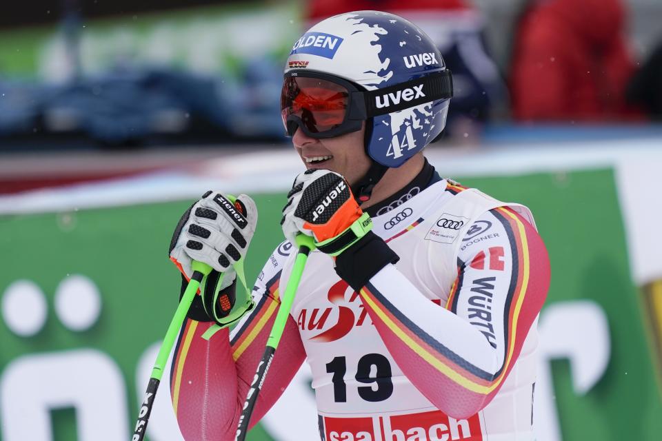Germany's Thomas Dressen celebrates at the finish area of an alpine ski, men's World Cup Super G, in Saalbach-Hinterglemm, Austria, Friday, Feb. 14, 2020. (AP Photo/Giovanni Auletta)