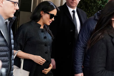 FILE PHOTO: Meghan Markle, Duchess of Sussex, exits a hotel in the Manhattan borough of New York City, New York, U.S., Feb.19, 2019. REUTERS/Carlo Allegri/File Photo