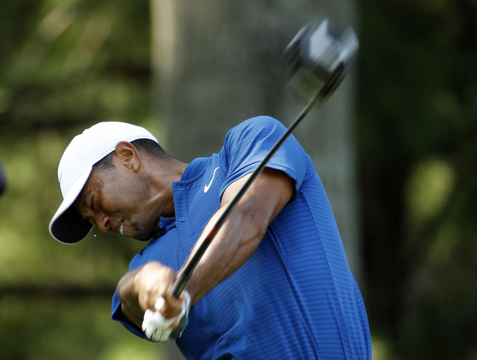 Tiger Woods tees off on the 15th hole during the third round of the PGA Championship golf tournament at Bellerive Country Club, Saturday, Aug. 11, 2018, in St. Louis. (AP Photo/Charlie Riedel)