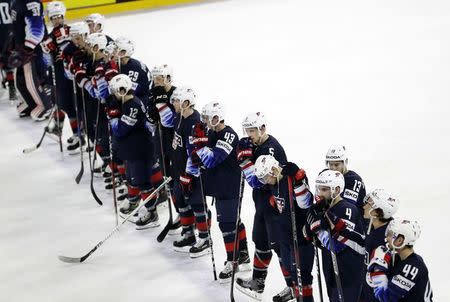 Ice Hockey - 2018 IIHF World Championships - Semifinals - Sweden v USA - Royal Arena - Copenhagen, Denmark - May 19, 2018 - Team U.S. looks dejected as they line up after the match. REUTERS/David W Cerny