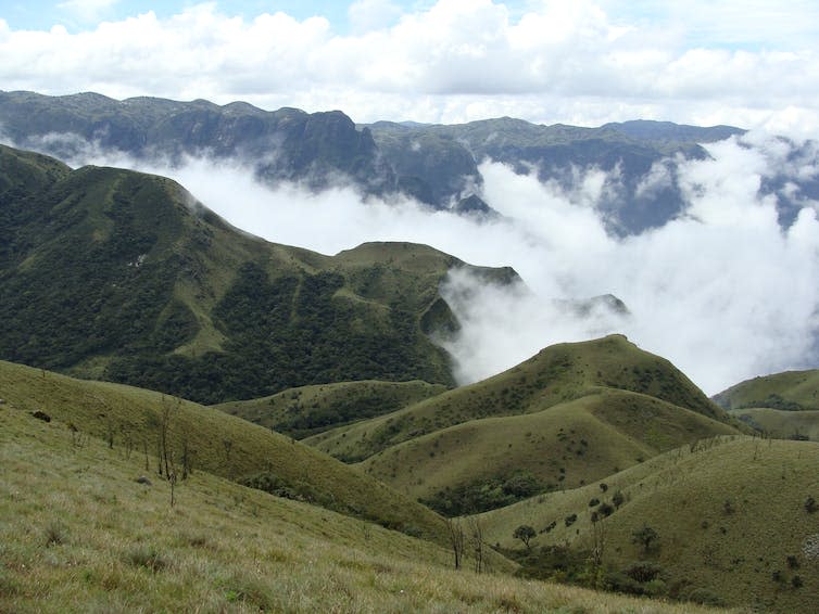 Mountains with a bank of clouds in the distance.