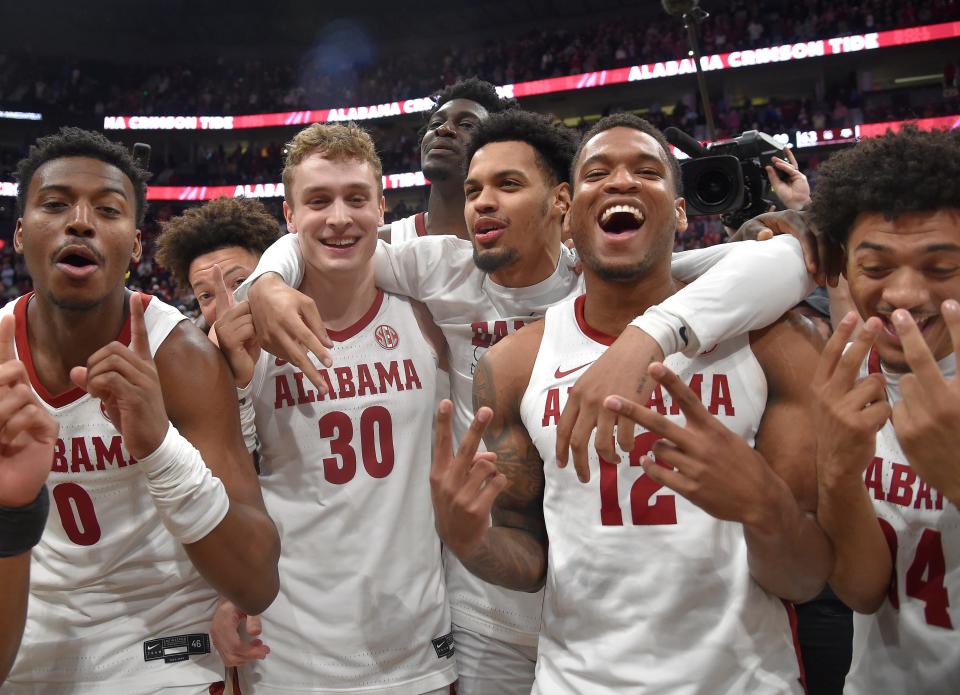 Alabama players Jaden Bradley, Charles Bediako, Jahvon Quinerly, Adam Cottrell, Delaney Heard and Rylan Griffen celebrate Sunday's win over Texas A&M in the SEC championship game. The Crimson Tide look like the best team in the NCAA Tournament. On paper, anyway.