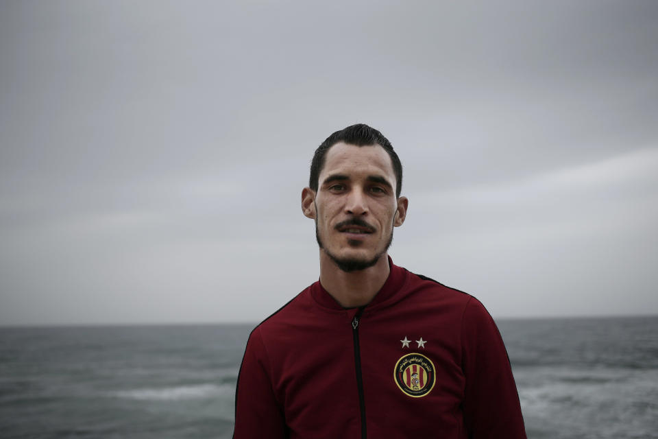 Khaled Arfaoui, 25, who wants to leave Tunisia, poses for photo at the beach where migrants leave for Italy, in the town of Ras Jabal, Bizerte, Tunisia, on April 14, 2018. He says, “If I get the chance, I’ll do it. Even if I fear the sea and I know I might die, I’ll do it.” From the closest points to Europe in Tunisia, Ras Jebel in the north and the Kerkennah Islands in the east, it's a half-day sail if all goes well. (AP Photo/Nariman El-Mofty)
