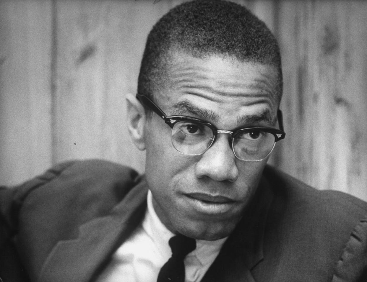 Malcolm X helped lead the Nation of Islam until 1964. <a href="https://www.gettyimages.co.uk/detail/news-photo/black-muslim-ldr-malcolm-x-explalining-why-he-is-quitting-news-photo/50333814?adppopup=true" rel="nofollow noopener" target="_blank" data-ylk="slk:Truman Moore/Getty Images;elm:context_link;itc:0;sec:content-canvas" class="link ">Truman Moore/Getty Images</a>