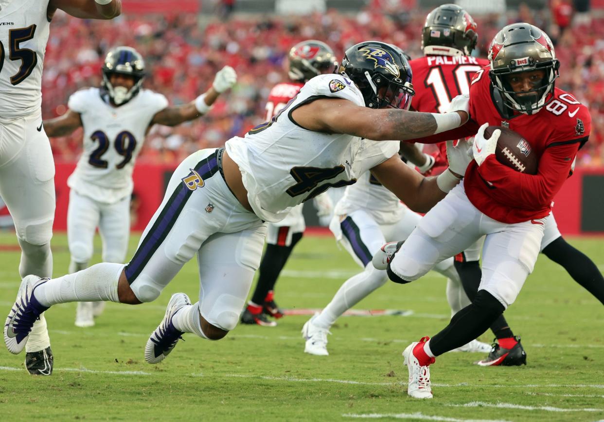 Aug 26, 2023; Tampa, Florida, USA; Tampa Bay Buccaneers wide receiver Kaylon Geiger (80) runs with the ball as Baltimore Ravens linebacker Malik Harrison (40) tackles during the first quarter at Raymond James Stadium. Mandatory Credit: Kim Klement Neitzel-USA TODAY Sports