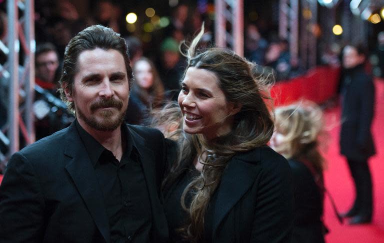 British actor Christian Bale and his wife Sibi Blazic arrive on the red carpet for the film "American Hustle" in the Berlinale Special category at the 64rd Berlinale Film Festival in Berlin, on February 7, 2014