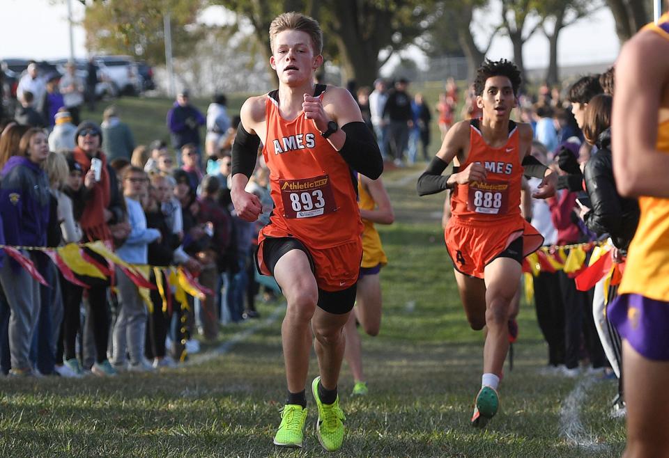 Zachary Lenkaitis (front) and Ahmed Aldamak both qualified for state individually for the Ames boys at the 4A qualifying meet at Pickard Park in Indianola Wednesday.