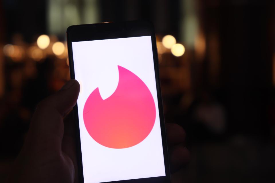 Tinder Logo can be seen on a Mobile Phone in New Delhi, India, on 26 July 2018. Tinder is a location-based social search mobile app that allows users to like or dislike other users, and allows users to chat if both parties swiped to the right. The app is often used as a hookup app (Photo by Nasir Kachroo/NurPhoto via Getty Images)