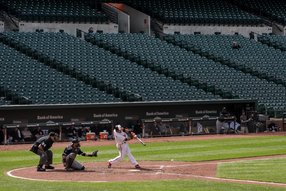 A batter hits the ball In the final inning against the Chicago White Sox in an empty Oriole Park at Camden Yards in Baltimore, MD April 29, 2015. The closing of the game to fans follows the unrest related to the death of city resident Freddie Gray who was arrested for possessing a switch blade knife and died while in custody of the Baltimore Police. Photo Ken Cedeno (Photo by Ken Cedeno/Corbis via Getty Images)