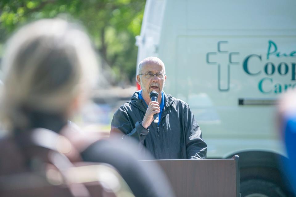 Corry Higbee, executive director for the Pueblo Cooperative Care Center, speaks during a ceremony celebrating the Mobile Shower Program at Mineral Palace Park on Wednesday, May 8, 2024.