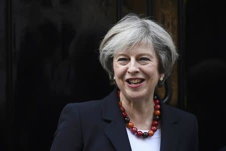 British Prime Minister Theresa May smiles as she greets her French counterpart Bernard Cazeneuve at Number 10 Downing Street in London, Britain, February 17, 2017. REUTERS/Toby Melville