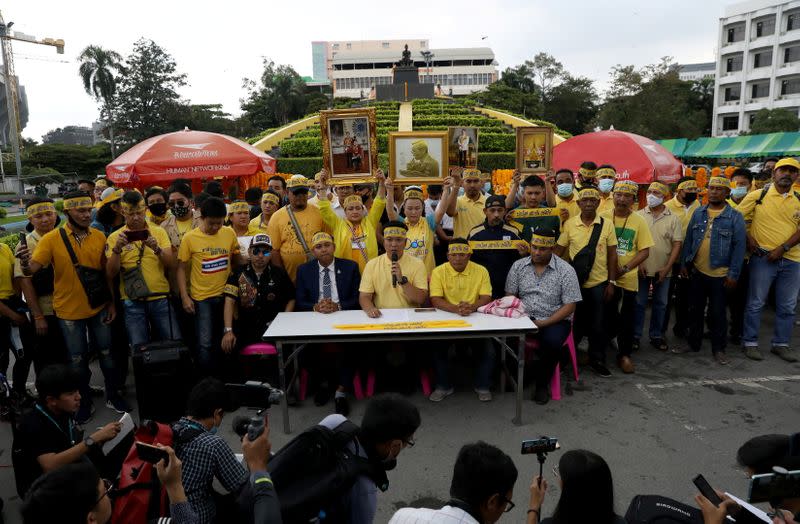 Royalists speak to media as they attend the gathering event to support Thailand's King Maha Vajiralongkorn in Bangkok