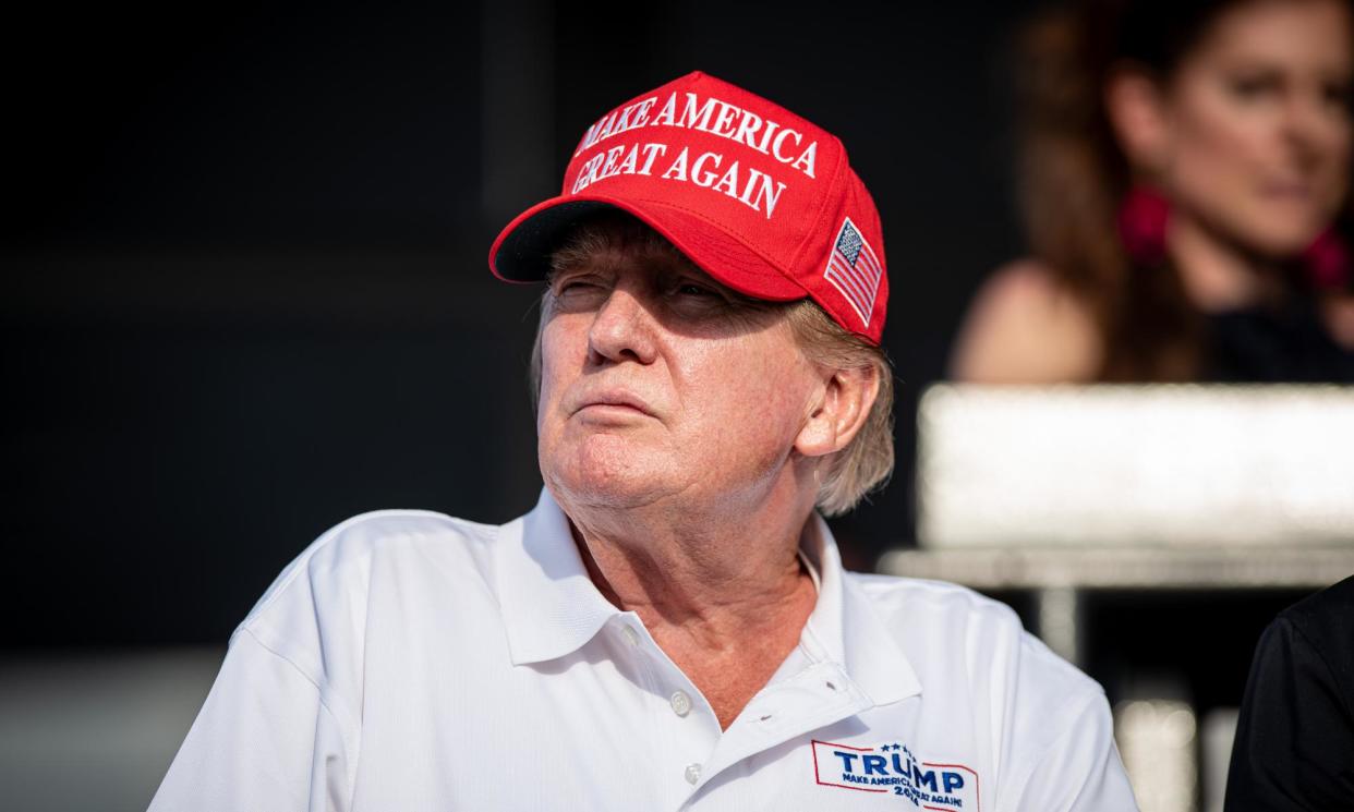 <span>Donald Trump at a gold tournament in Doral, Florida, on Sunday.</span><span>Photograph: Anadolu/Getty Images</span>