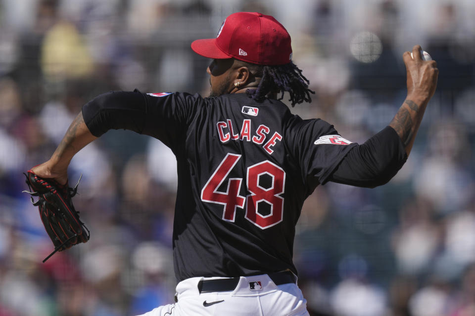 Cleveland Guardians relief pitcher Emmanuel Clase throws in the third inning of a spring training baseball game against the Los Angeles Dodgers, Monday, March 11, 2024, in Goodyear, Ariz. (AP Photo/Carolyn Kaster)