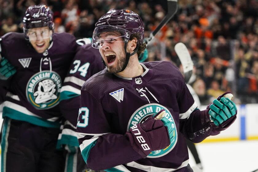 Anaheim Ducks center Mason McTavish, front, reacts after scoring during the third period.