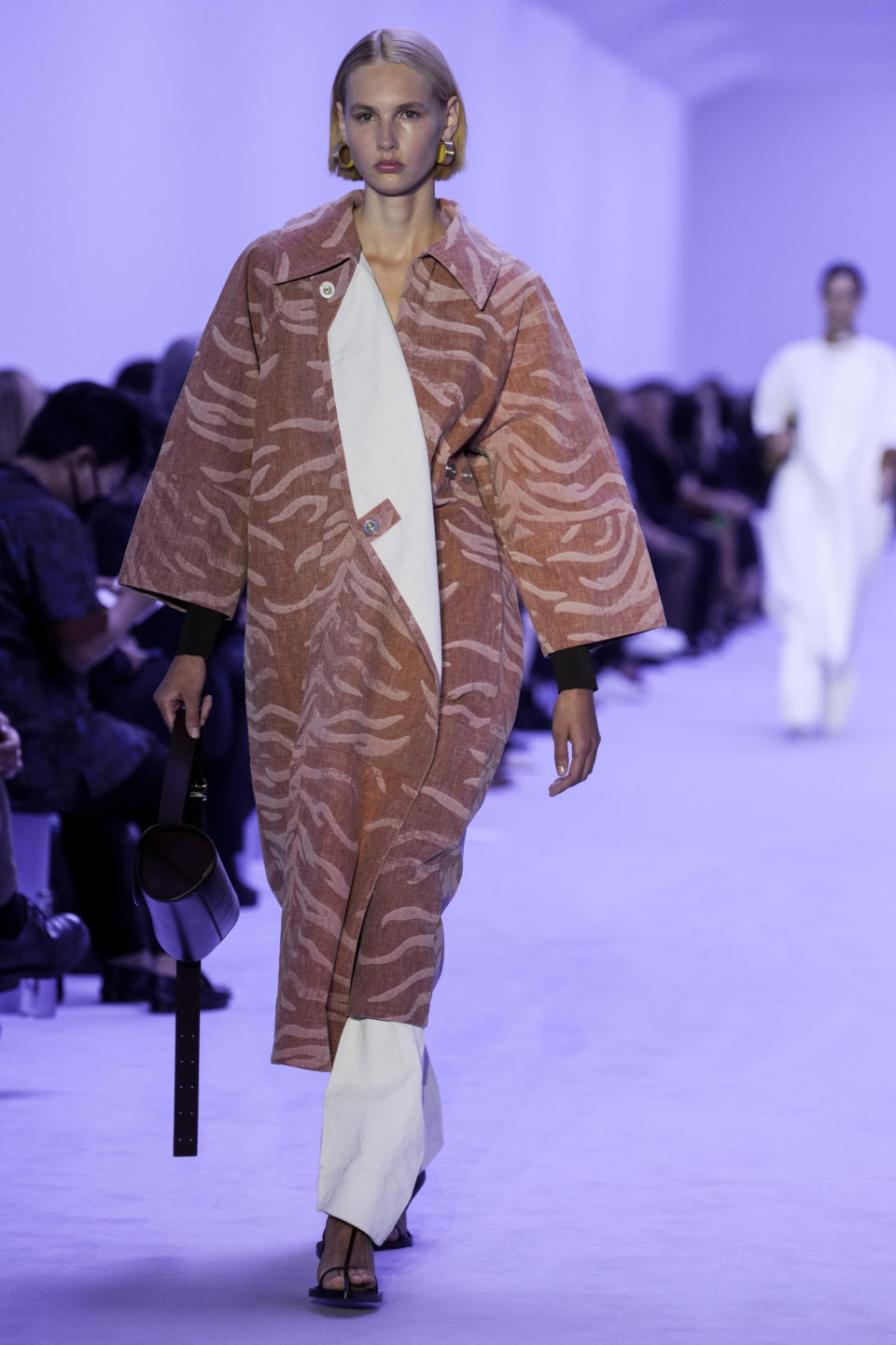 A model wears a creation for the Jil Sander Spring Summer 2022 collection during Milan Fashion Week, in Milan, Italy, Wednesday, Sept. 22, 2021. (AP Photo/Luca Bruno)