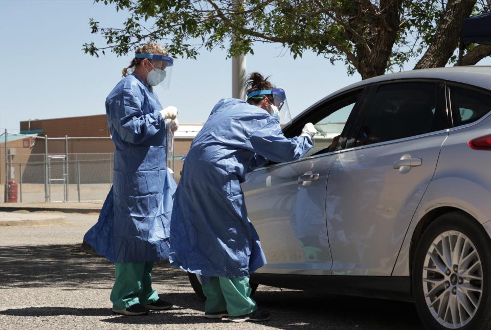 Health care workers from Northern Navajo Medical Center, San Juan County Public Health Office and the National Guard collected samples from the public at a free testing site for COVID-19 on May 5, 2020, at Shiprock High School in Shiprock.