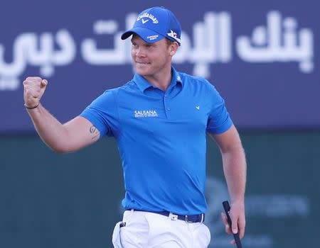 Danny Willett of England celebrates after winning the Dubai Desert Classic golf championship February 7, 2016. REUTERS/Ahmed Jadallah