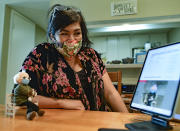 Tobey King, of Corpus Christi, Texas, gets emotional as the crochet Bernie Sanders doll that she made sells on eBay for $20,300 on Tuesday, Jan. 26, 2021. All of the proceeds are being donated to Meals on Wheels. (Billy Calzada/The San Antonio Express-News via AP)