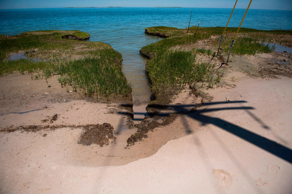 <p>Erosion eats away at the tip of the Uppards in an area called Canaan in Tangier, Virginia, May 16, 2017, where climate change and rising sea levels threaten the inhabitants of the slowly sinking island.<br> (Jim Watson/AFP/Getty Images) </p>