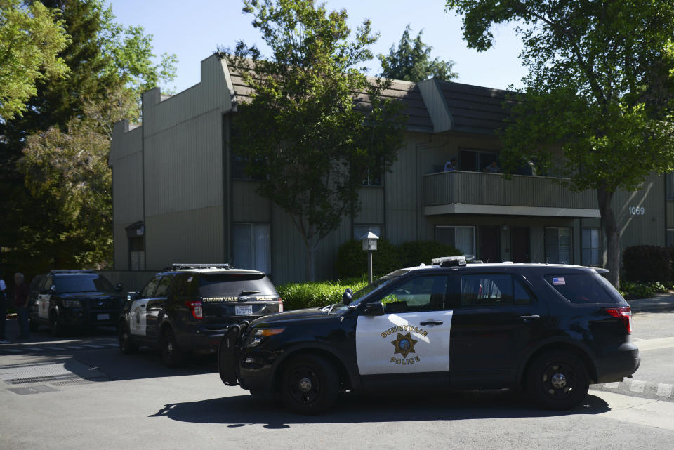 Police vehicles surround the apartment complex believed to be associated with a car crash suspect in Sunnyvale, Calif., Wednesday, April 24, 2019. A witness to a California crash that injured eight people said Wednesday he was waiting for a traffic light to turn green when a Toyota Corolla plowed through the intersection at a high speed, sending pedestrians flying into the air in the Silicon Valley city of Sunnyvale. (AP Photo/Cody Glenn)