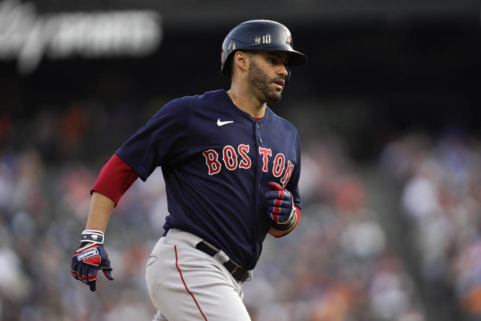 Boston Red Sox's J.D. Martinez rounds third base after hitting a solo home run against the Detroit Tigers in the second inning of a baseball game in Detroit, Wednesday, Aug. 4, 2021. (AP Photo/Paul Sancya)