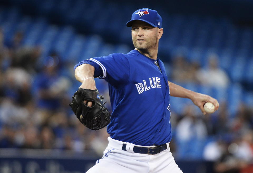 Toronto Blue Jays starting pitcher J.A. Happ works against the Kansas City Royals during the first inning of another quietly strong performance. (Nathan Denette/CP)