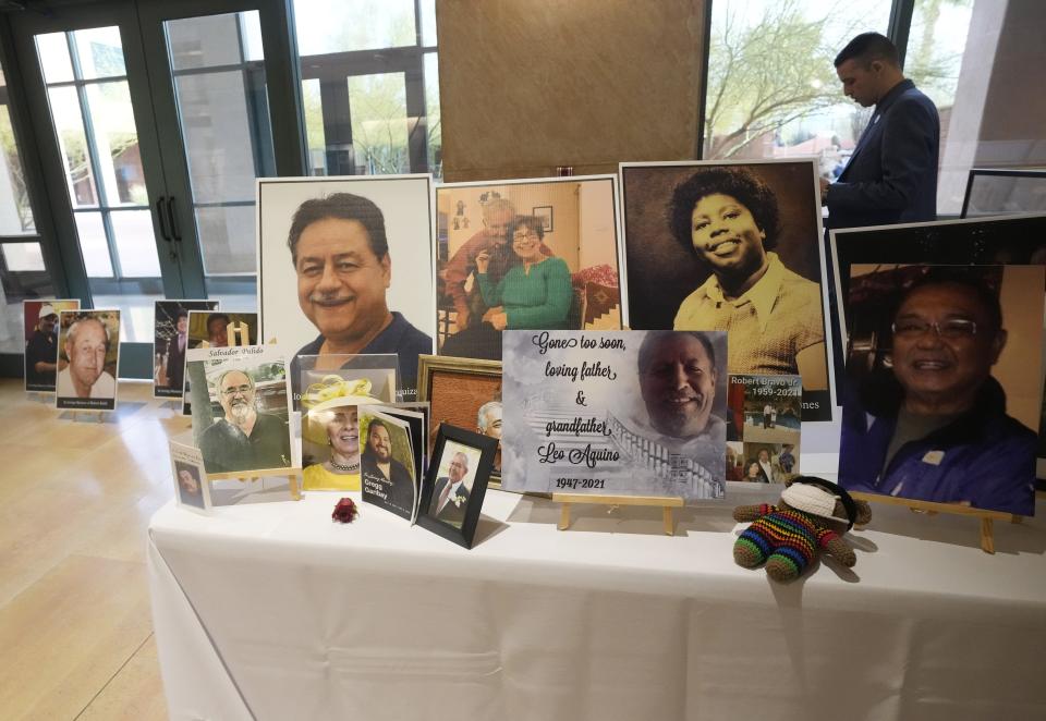 Photos memorializing people lost to COVID-19 are displayed during a memorial event at the Arizona Heritage Center on March 6, 2023.