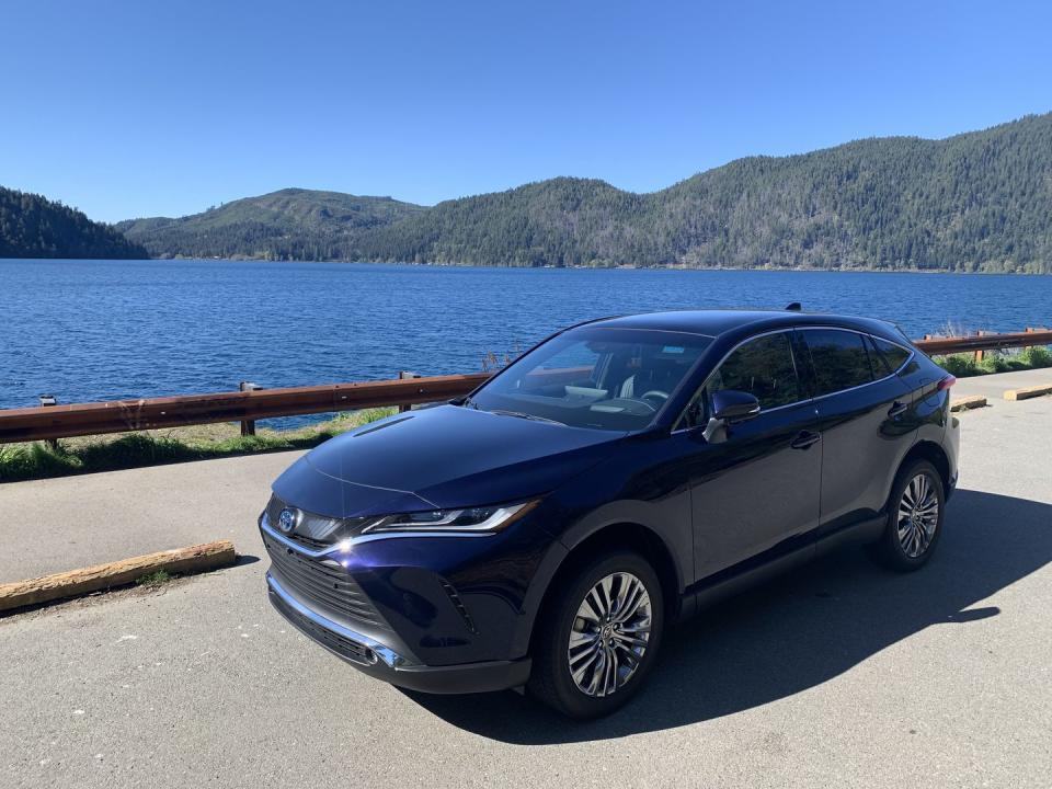 2024 toyota venza limited parked on a road by a body of water