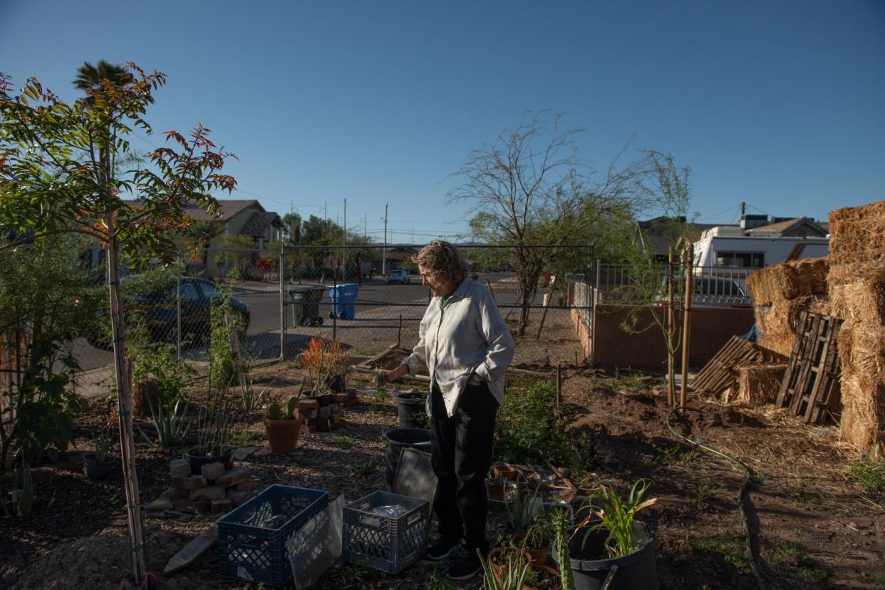 <span>Susan Ontiveros next to the freshly planted trees in her and Silverio's front yard.</span><span>Photograph: Tamuna Chkareuli/The Guardian</span>