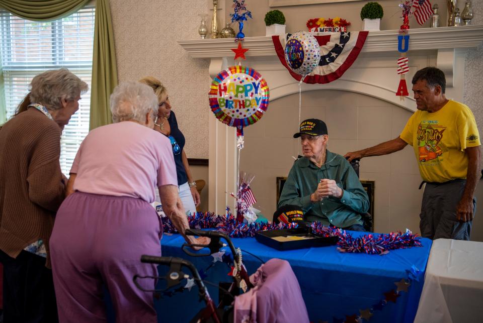 Friends sing “Happy Birthday” to U.S. Army veteran Thurman Carnal while celebrating his 107th birthday at Solarbron Terrace in Evansville, Ind., Thursday, July 6, 2023.