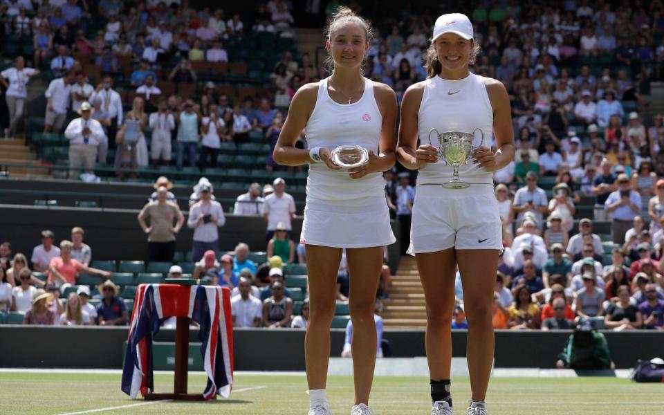 Swiatek (right) celebrates with runner-up Leonie Kung of Switzerland - Swiatek (right) celebrates with runner-up Leonie Kung of Switzerland - AP