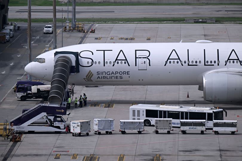 The Singapore Airlines Boeing 777-300ER airplane, which was headed to Singapore from London before making an emergency landing in Bangkok due to severe turbulence, at Suvarnabhumi International Airport on May 22