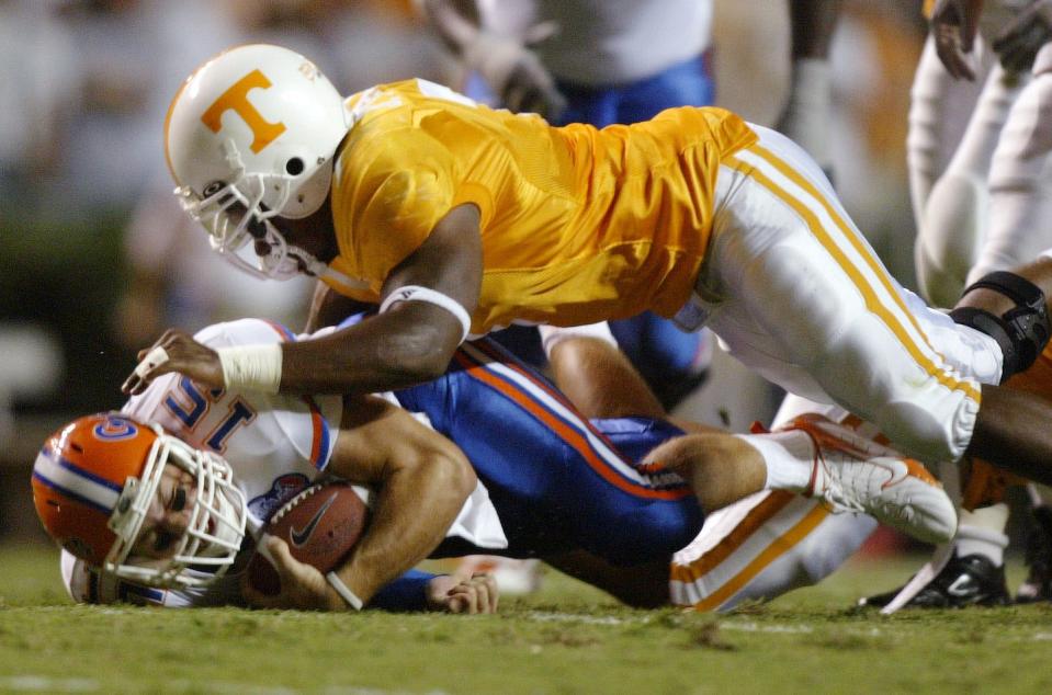 Tennessee's Jerod Mayo takes down  Florida quarterback Tim Tebow on Saturday at Neyland Stadium.