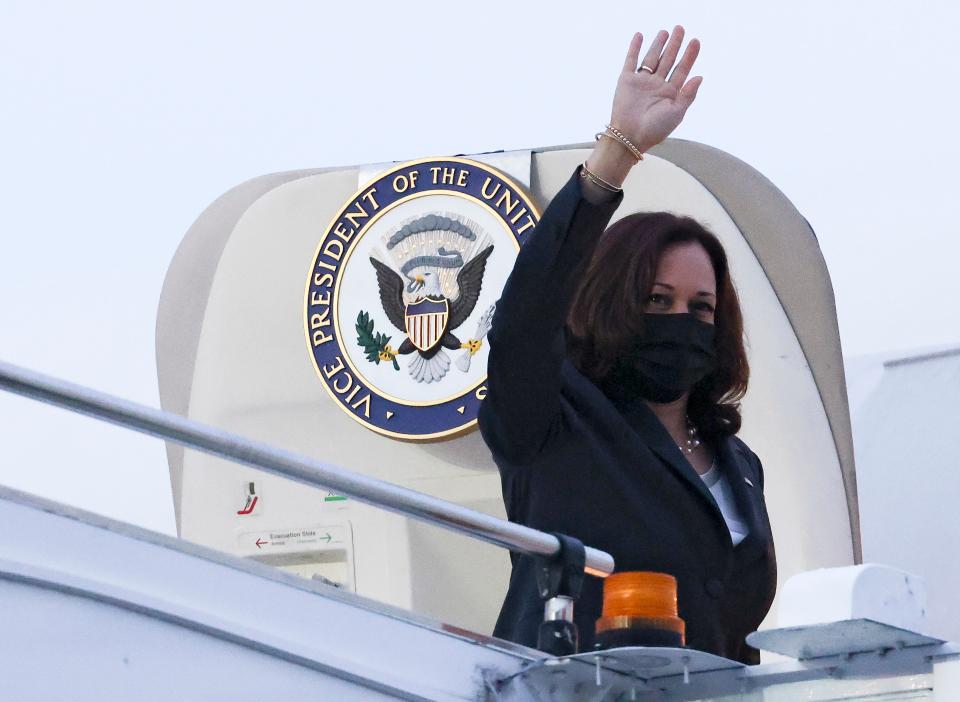 Vice President Kamala Harris waves as she departs Singapore to Vietnam on 24 August.  (AP)