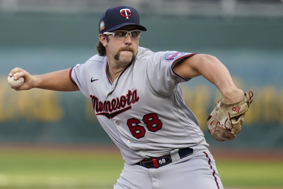 Minnesota Twins relief pitcher Randy Dobnak delivers to a Kansas City Royals batter during the first inning of a baseball game at Kauffman Stadium in Kansas City, Mo., Saturday, Aug. 22, 2020. (AP Photo/Orlin Wagner)