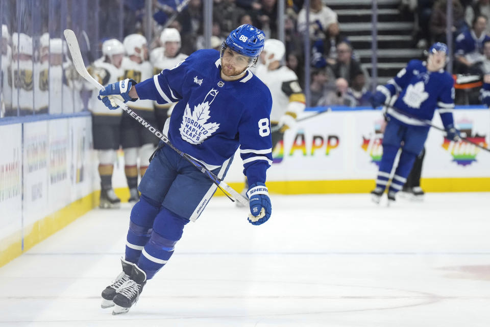 Toronto Maple Leafs' William Nylander (88) reacts as the Vegas Golden Knights celebrate a goal during the second period of an NHL hockey game in Toronto, on Tuesday, Feb. 27, 2024. (Chris Young/The Canadian Press via AP)