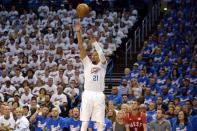 May 6, 2016; Oklahoma City, OK, USA; Oklahoma City Thunder guard Andre Roberson (21) shoots the ball against the San Antonio Spurs during the first quarter in game three of the second round of the NBA Playoffs at Chesapeake Energy Arena. Mandatory Credit: Mark D. Smith-USA TODAY Sports