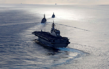 FILE PHOTO: Japanese helicopter carrier Kaga (front) Japanese destroyer Inazuma (C) and British frigate HMS Argyll take part in a joint naval drill in the Indian Ocean, September 26, 2018. REUTERS/Kim Kyung-Hoon/File Photo