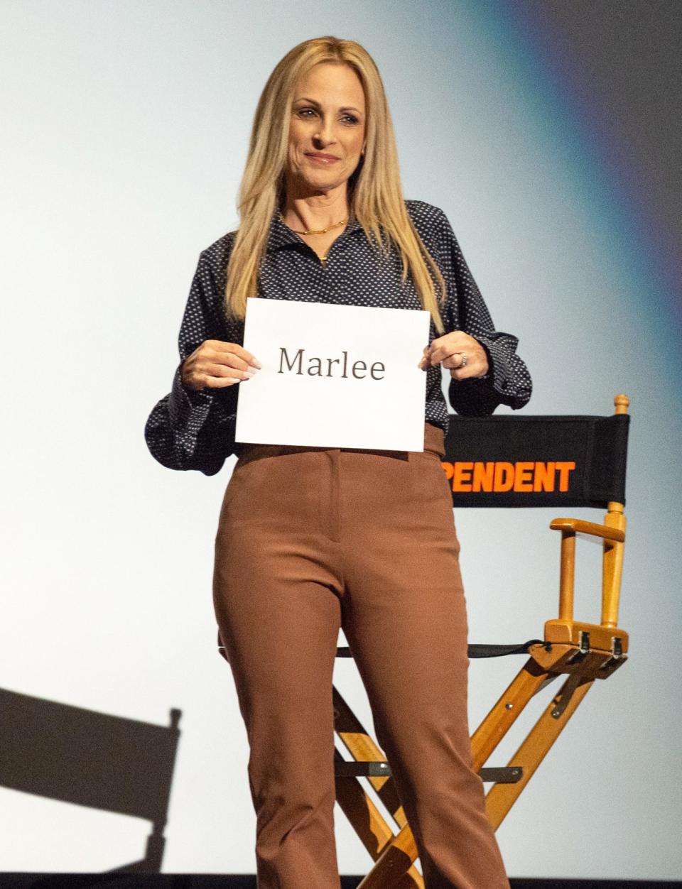 <p>Marlee Matlin holds up a sign with her name on it at the Film Independent Special Screening of <i>CODA</i> at Harmony Gold on Sept. 14 in L.A. </p>