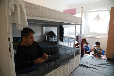 Marwan Ahman and his family rest in their room at the camp for refugees and migrants in the Belgrade suburb of Krnjaca, Serbia, January 16, 2018. Picture taken January 16, 2018 REUTERS/Djordje Kojadinovic