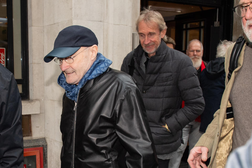 Phil Collins (left) and Mike Rutherford leave BBC Wogan House after appearing on Radio 2's Zoe Ball show, to announce that Genesis are to reform to tour the UK later this year. (Photo by Dominic Lipinski/PA Images via Getty Images)