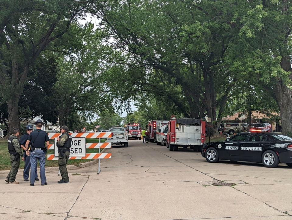 Police cordon off a street where four victims were found on Thursday morning (AP)