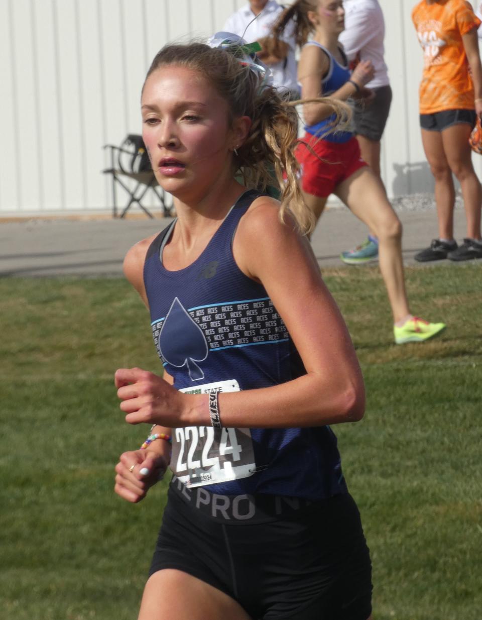 Granville senior Ella Johnson nears the finish line in the Division II girls race during the state championships at Fortress Obetz in November 2022. Johnson placed 13th individually to lead the Blue Aces to the program's second team championship.