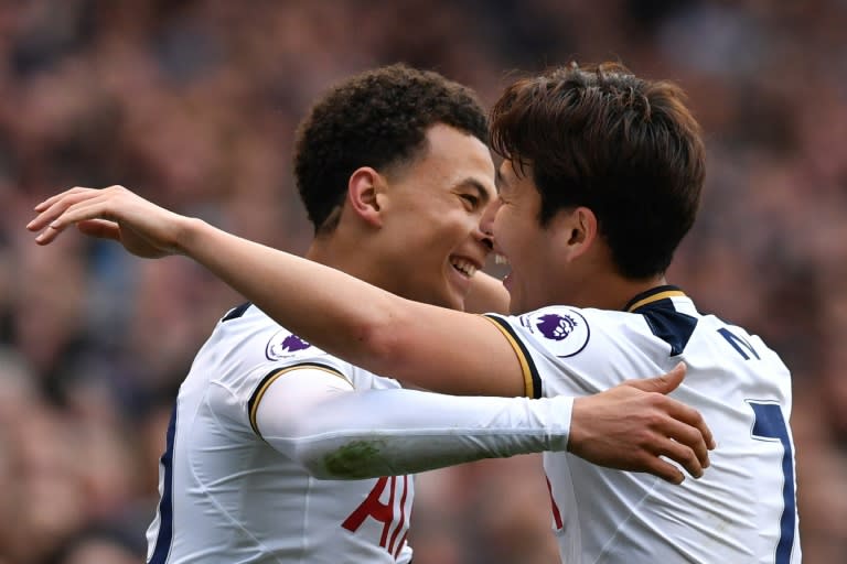 Tottenham Hotspur's midfielder Dele Alli (L) celebrates scoring against Arsenal with Son Heung-Min on April 30, 2017