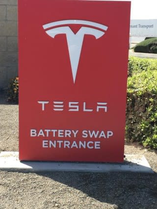 Tesla Battery Swapping sign, Harris Ranch, California, March 2015 [photo: Lenn Goodside]