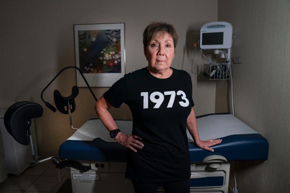 Renee Chelian, executive director and founder of the Northland Family Planning Centers poses Friday, June 24, 2022 in a clinic wearing a shirt with a nod to the year Roe v. Wade was sworn into law.