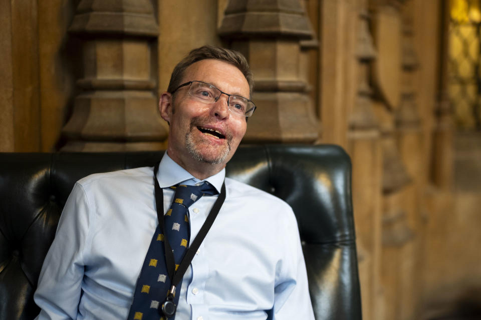 Conservative legislator Craig Mackinlay speaks during an interview in the Central Lobby of the Palace of Westminster, London, Wednesday May 22, 2024. Mackinlay returned to work six months after sepsis put him in a coma and forced the amputation of his hands and feet. (Jordan Pettitt/PA via AP)