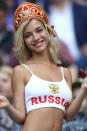 <p>A female Russian fan shows her support for the host nation in Moscow. (PA) </p>