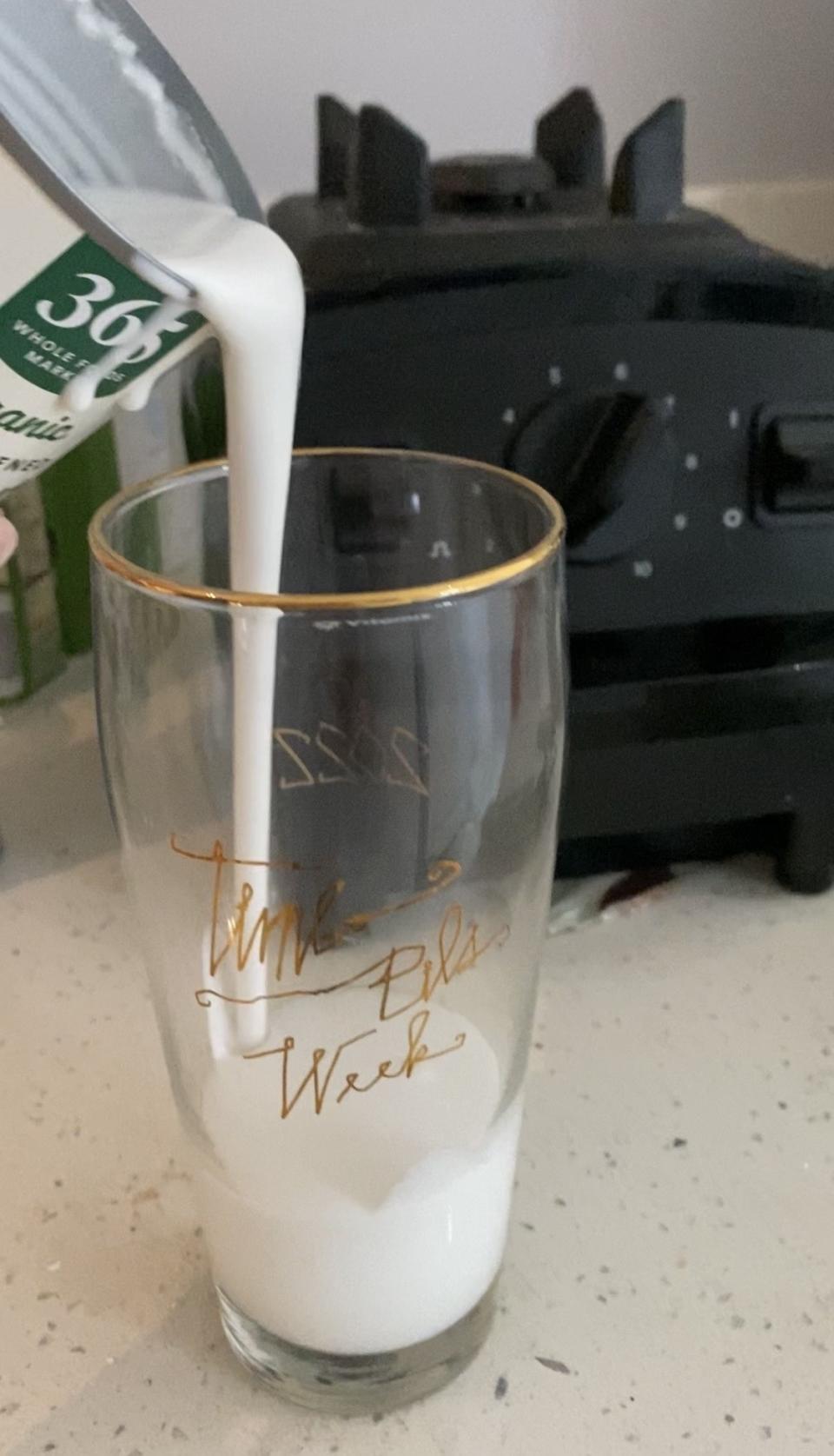 The writer pouring coconut cream in a cup